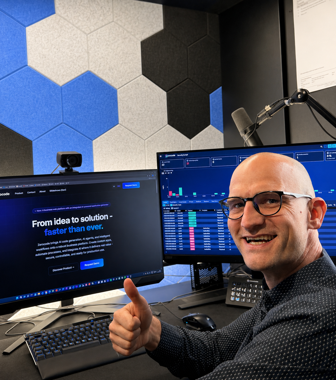 Alexander Zach at his workstation giving a thumbs up